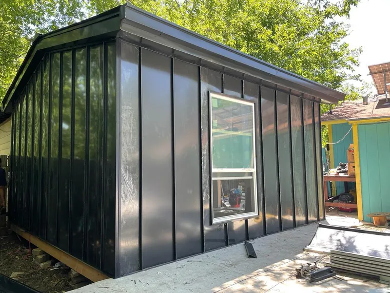 Black standing seam metal wall panels for Roof Inspection in Tomah